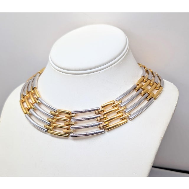 1980s goldtone and rhodium plated interlocking links wide collar necklace with hook clasp. Marked "GIVENCHY©" on the back...