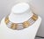 1980s goldtone and rhodium plated interlocking links wide collar necklace with hook clasp. Marked "GIVENCHY©" on the back...