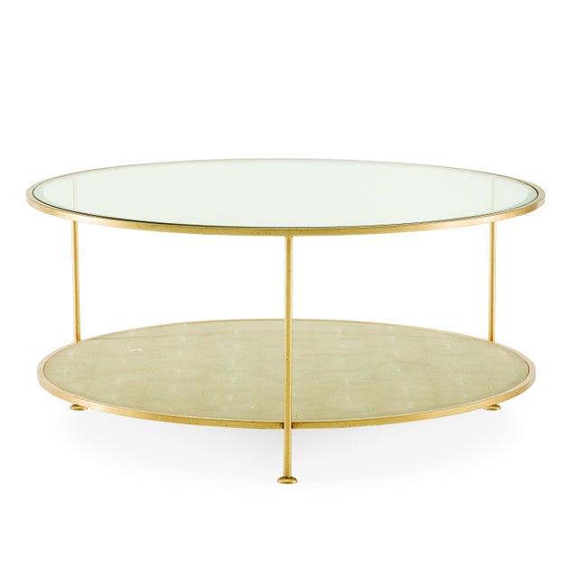 This piece is available only as shown, and will ship in 2-3 weeks. This three legged transitional cocktail table features...