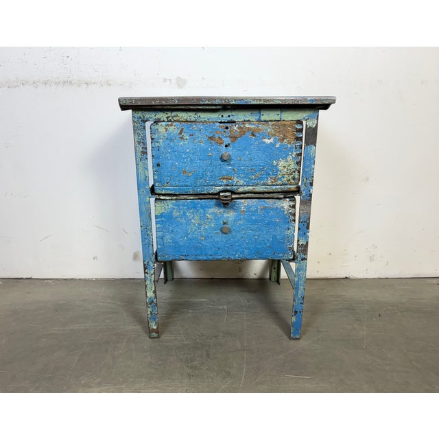 This vintage Industrial chest of drawers was made in former Czechoslovakia during the 1950s. It features an iron...