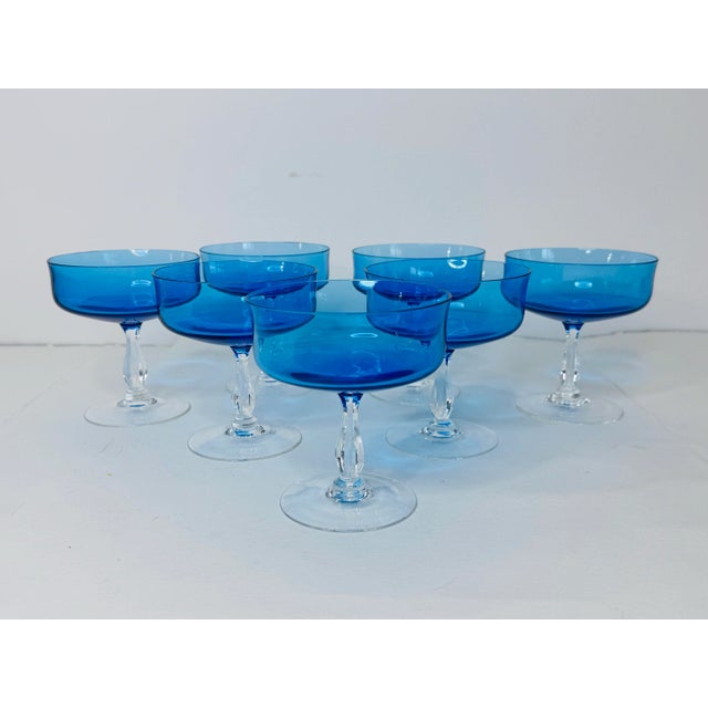 Vintage 1960s Periwinkle Blue Glass Coupes, Set of 7. Excellent condition with a beautiful color and clear base. No makers...