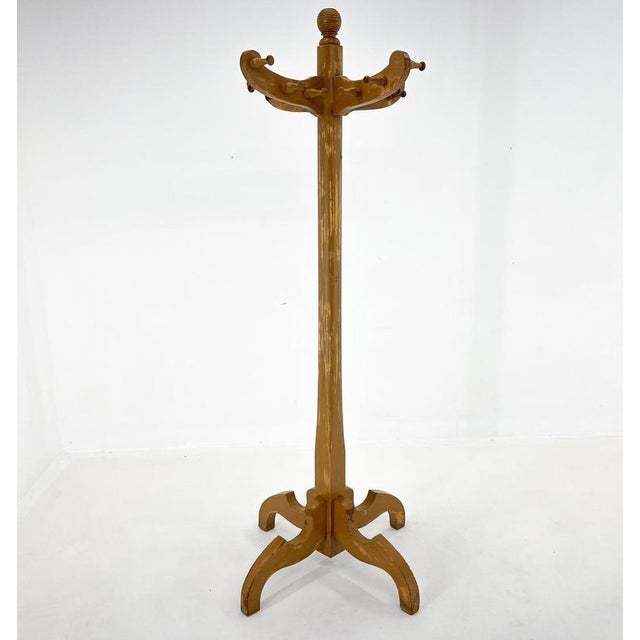 Large vintage raw wood coat hanger. Very stable. Original paint was partialy sanded and the hanger was treated with...