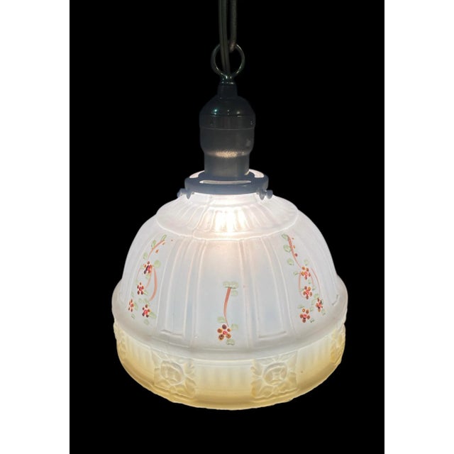 This brilliant pendant lamp has a stunning bright yellow shade from the 1930’s with a beautiful reverse painted floral...