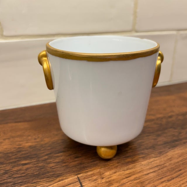 Vintage Miniature tabletop cachepot of white porcelain with gilded handles, rim, and ball feet ready for your table scape....