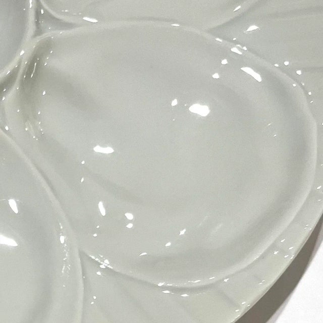 Lovely vintage late 20th century white porcelain oyster plate by Pillivuit France. Features ridged "striped" background...