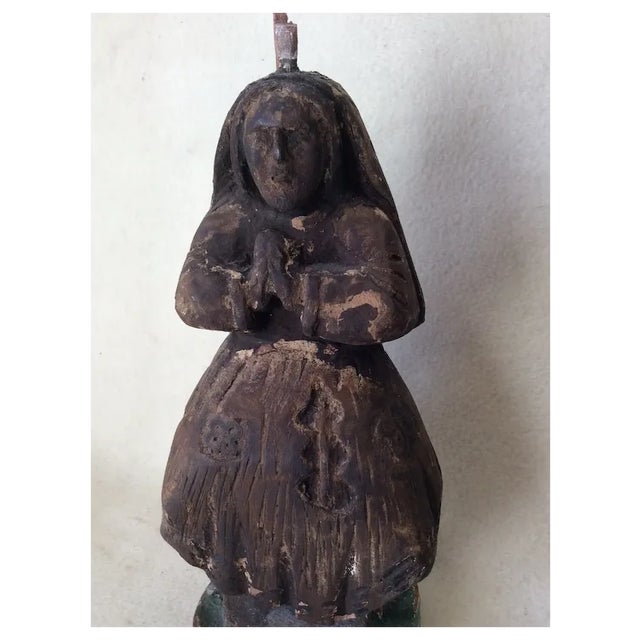 An early Antique hand carved Christian Santos, Saint, Nun or Relic. The Santos is hand carved from wood and has traces of...
