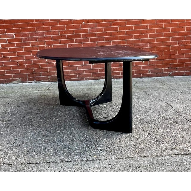 Outstanding Italian coffee table handcrafted out of marble, 1970s. The teardrop shaped top are made of very beautiful...