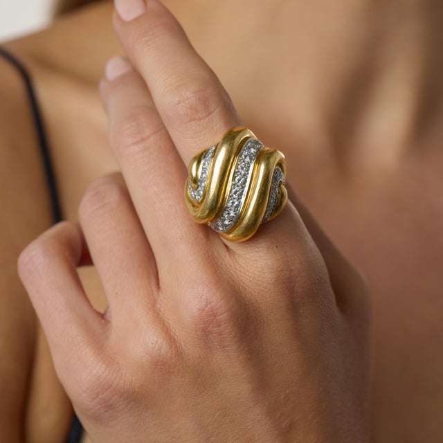 This striking vintage Andrew Clunn cocktail ring is a bold and beautifully crafted design from the 1980’s, showcasing the...