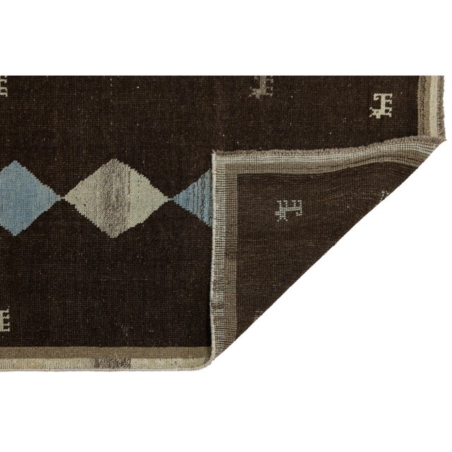 Elevate your home with this authentic hand-knotted Gabbeh runner. Crafted from 100% high-quality, hand-spun wool, this rug...