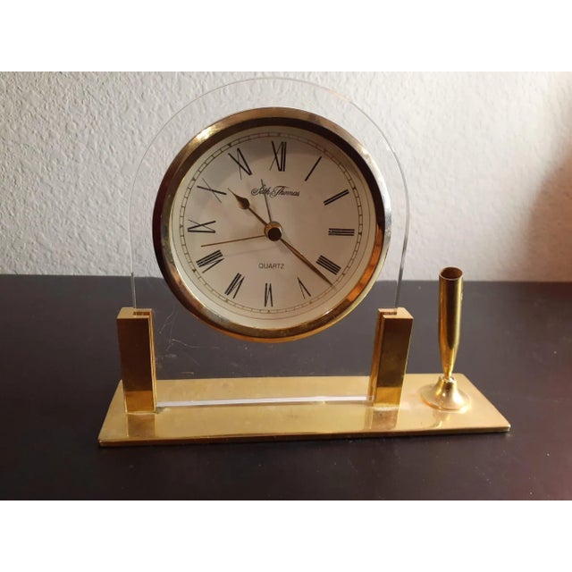 This is Seth Thomas Brass Desk or Mantle Clock with Pen Holder. Procured at an estate auction