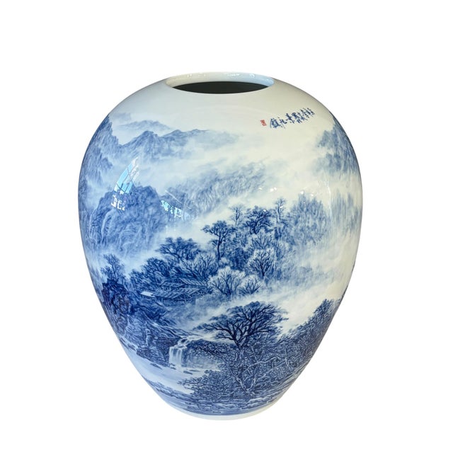 This exquisite vintage hand-painted Egg Shaped Chinoiserie Blue and White Vase features intricate landscape designs of a...