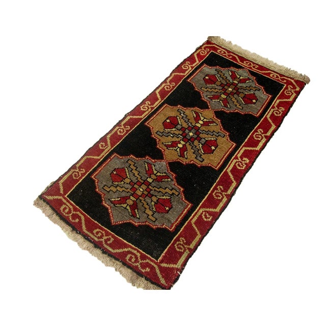 Vintage Handknotted decorative mini rug from Kars region of Turkey. Approximately 45-55 years old. In very good condition.