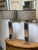 Design Plus Gallery presents a Pair of Chrome Cork Table Lamps. The lamps have a chrome base with cylindrical stem that is...