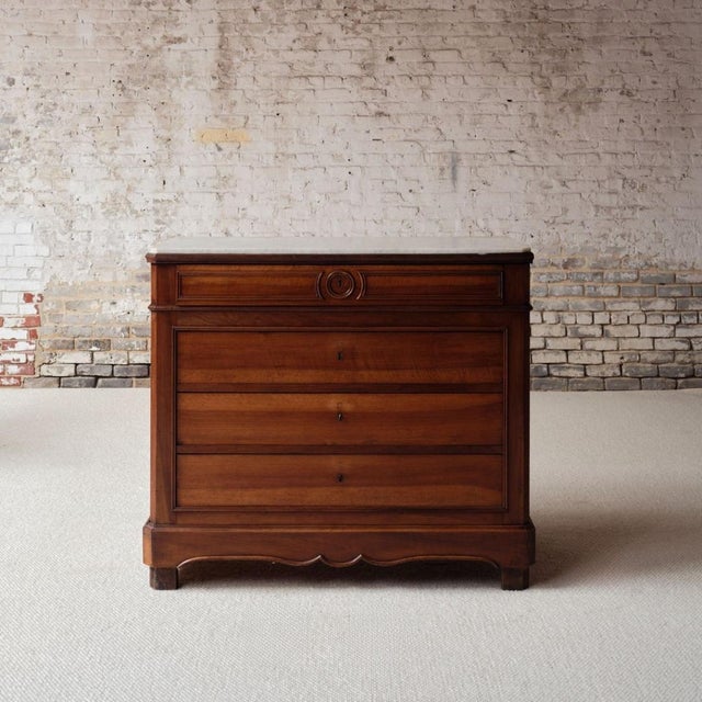 Elevate your space with this late 19th century French walnut buffet with marble top, a timeless piece that blends refined...