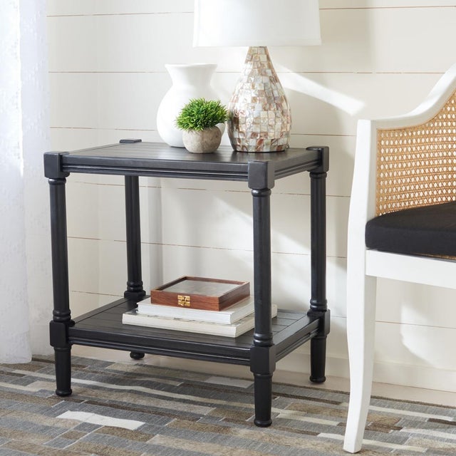 This Rafiki Rectangle Accent Table brings a touch of classic charm to any interior with its fresh new take on British...
