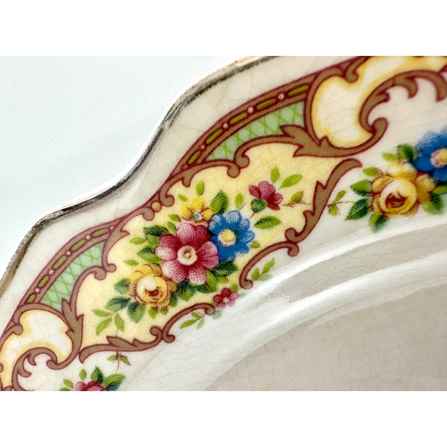 This set of 7 Mount Clemens luncheon plates from the 1930s is a beautiful representation of the period's charm and...