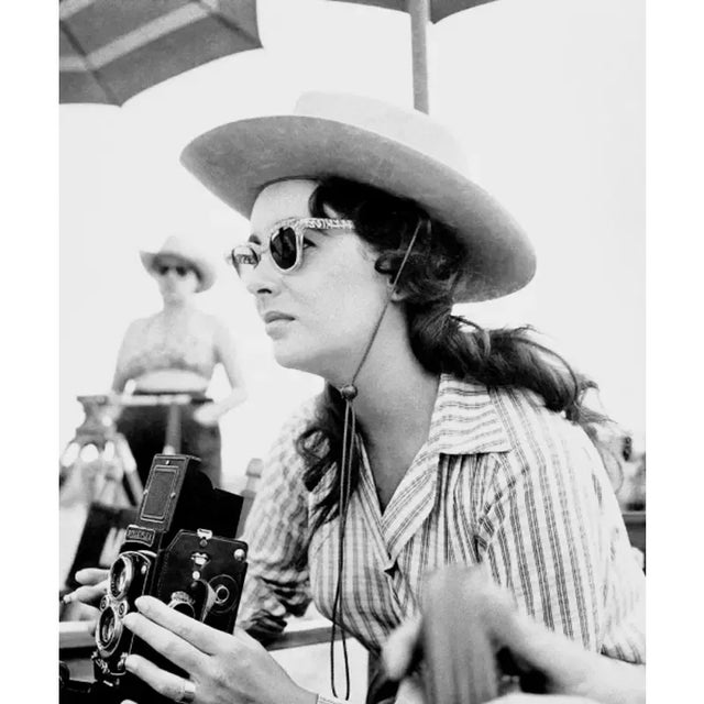 Elizabeth Taylor with Vintage Camera Actress Elizabeth Taylor takes a photo with a Rollieflex twin lens medium format...