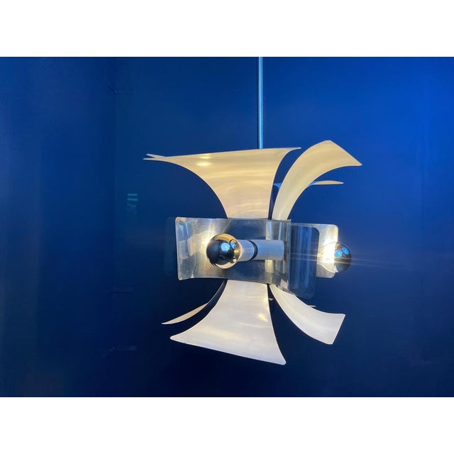 Space age era italian chandelier made from bent aluminum sheets of metal with a white reflective finish. Tested and ready...