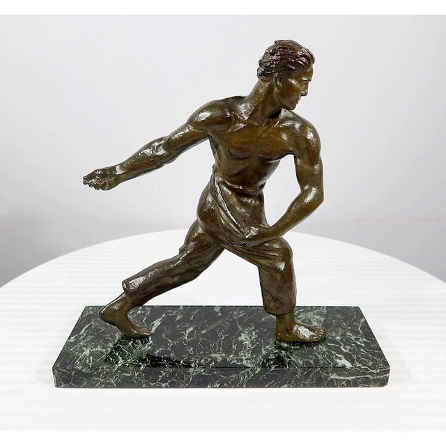 A handsome, large bronze sculpture by Alexandre Kelety, with a harmonious green patina, depicting an athletic man sowing...