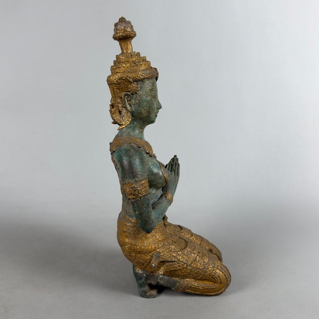 This imposing bronze sculpture depicts a Thepphanom, an angelic deity from Thai mythology, traditionally considered a...