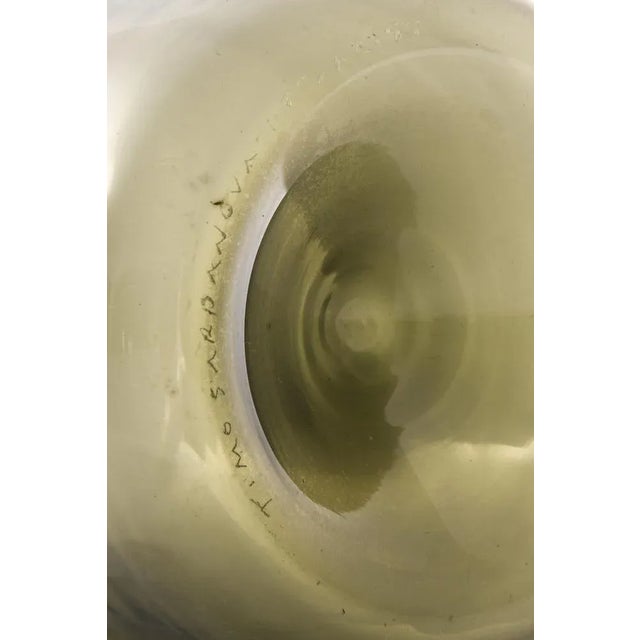 Glass Bottle / Vase Model bottle Designed by Timo Sarpaneva. Produced by Iittala in Finland. This piece is attributed to...