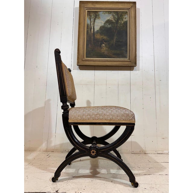 A rare and highly decorative example of 19th-century design, this fine Aesthetic Movement chair in the manner of Lamb of...