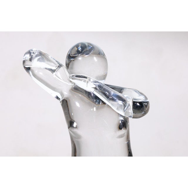 An Elio Raffaeli for Salviati Murano glass figurative woman table sculpture. This stunning glass sculpture features a...