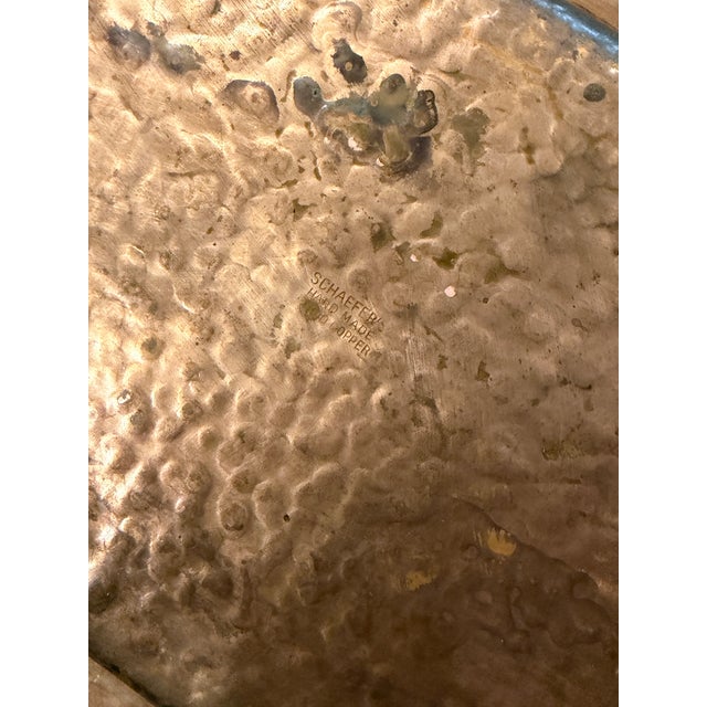 Schaeffer’s handmade solid copper serving tray. This rectangular tray has a hammered texture across the entire surface and...
