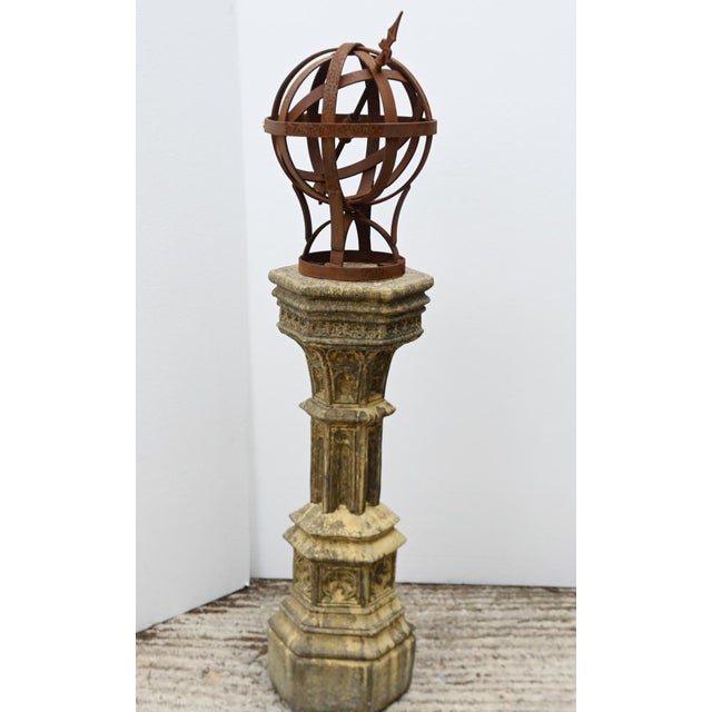 Decorative garden armillary sphere on an architectural cast stone pedestal Classical pedestal with Gothic Revival style...