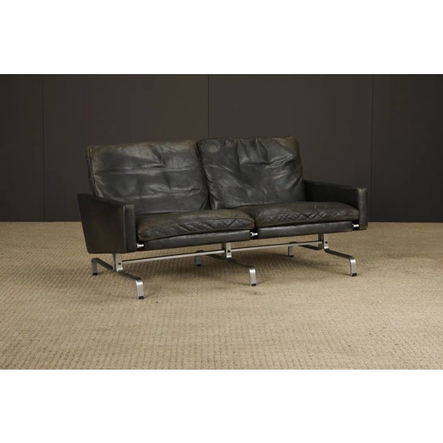 This highly collected early production original of the PK-31 loveseat sofa by Poul Kjærholm for E. Kold Christensen has...