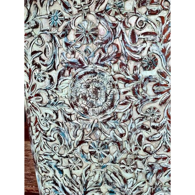 An extraordinary vintage Indian barn door, hand-carved with elegant lotus motifs and finished in a beautifully distressed...