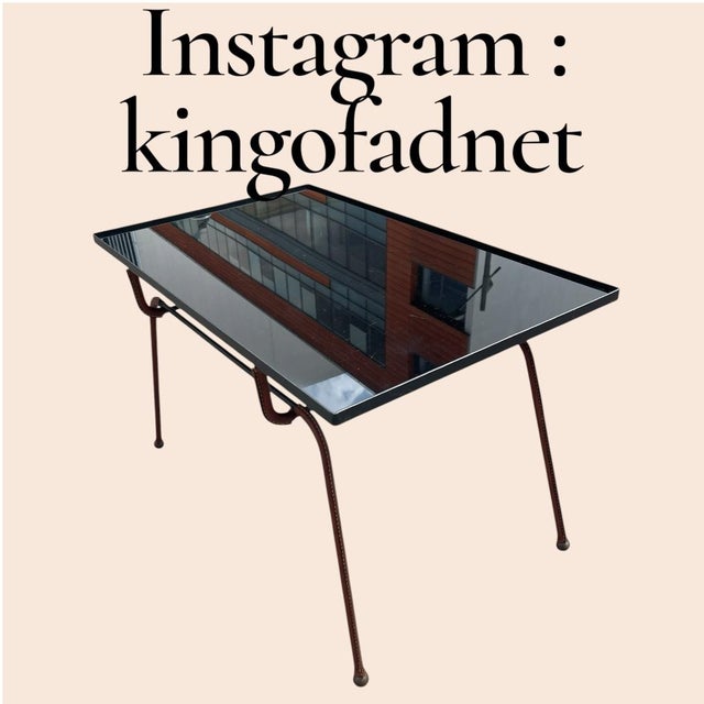 A Rare French Midcentury Modern hand stitched leather cocktail table by Jacques Adnet, circa 1955. Adnet had a rare talent...