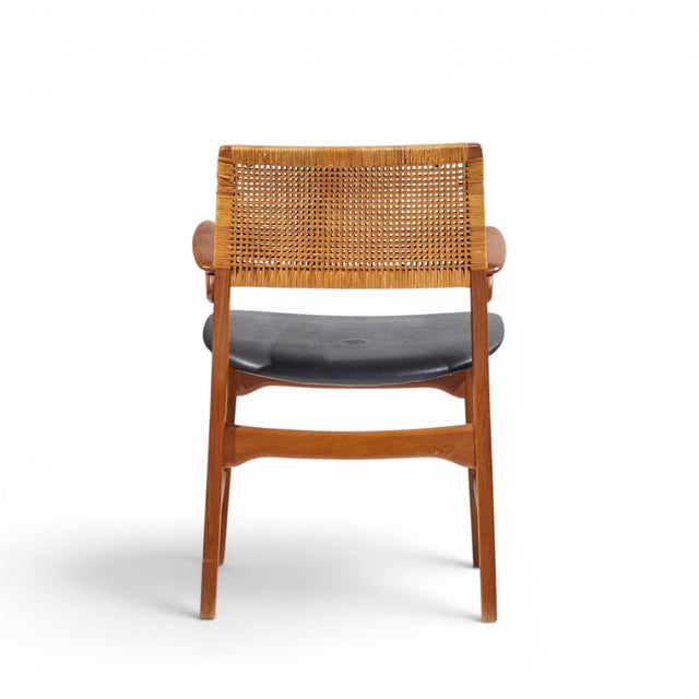 E. Knudsen for Jensen & Lykkegaard Model 48 Mid Century Danish Teak and Cane Dining Arm Chair This chair measures: 20.75...
