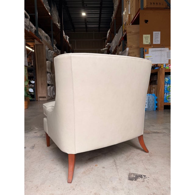 Timeless and versatile, this classic transitional accent chair features soft ivory leather upholstery, clean contemporary...