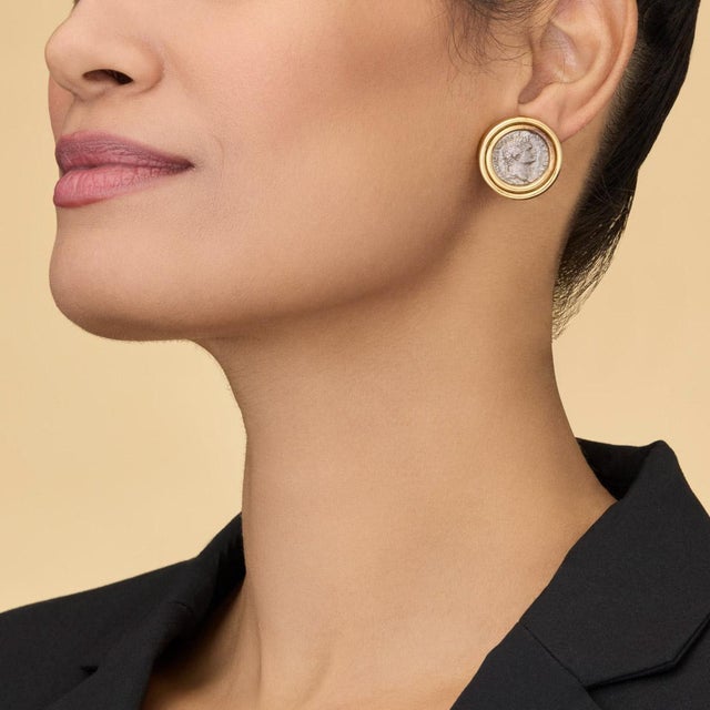 Own a piece of history with these rare antique Roman coin earrings, expertly set in solid 18K yellow gold. The authentic...
