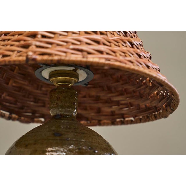 French Olive Green Glazed Studio Pottery Table Lamp with Rattan Shade, 1960s For Sale - Image 11 of 12