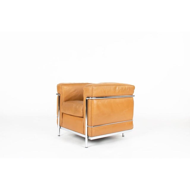 The lc2 armchair, designed in 1928 by le corbusier, pierre jeanneret, and charlotte perriand, is one of the most iconic...