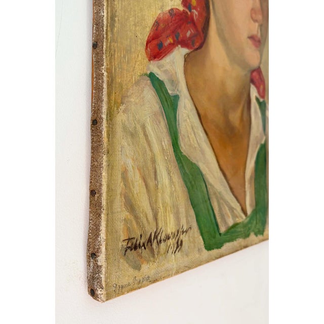 Dating from 1939, a beautiful European oil portrait painting of a young farmer woman. This original oil painting signed...