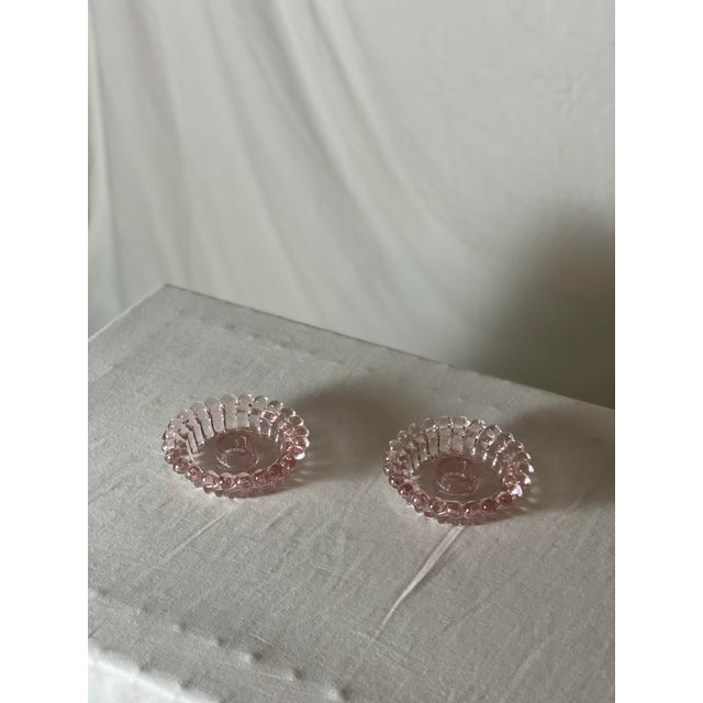 Pressed glass boopie bubble short candle stick holders. They fit a standard taper candle, and they are a beautiful way to...