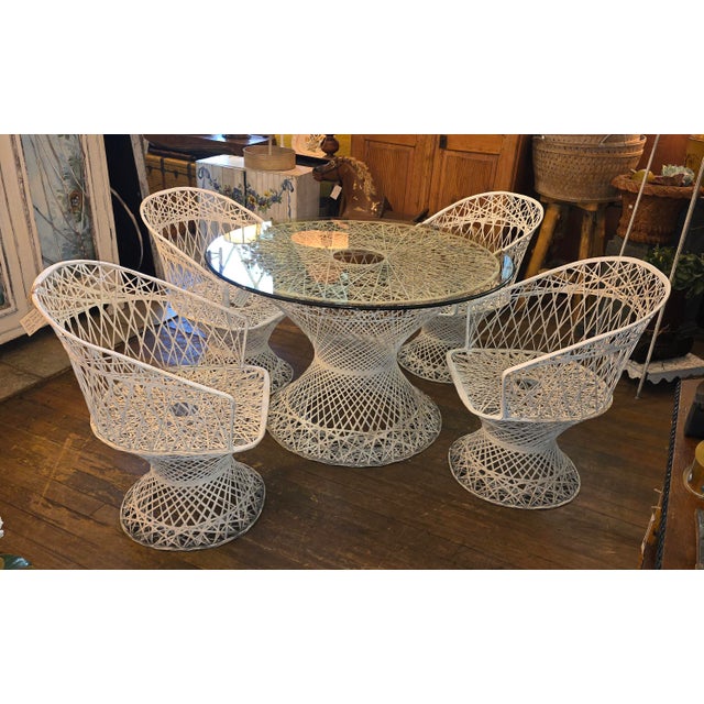 This Spun Fiberglass dining patio set is in good shape, the top of it is a 47" round glass with beveled edge. The height...