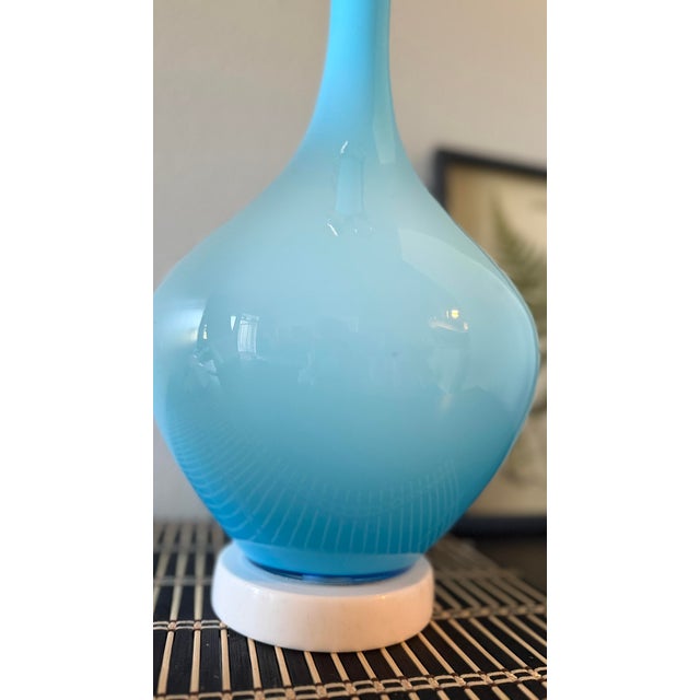 I have a beautiful, vintage mid-century modern glass table lamp. It features a stunning gradient sky-blue to baby blue...