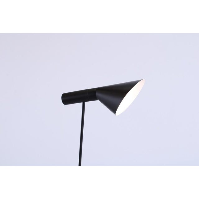 Arne jacobsen at first designed this ‘visor’ floor light exclusively for the interior of the royal sas hotel in...