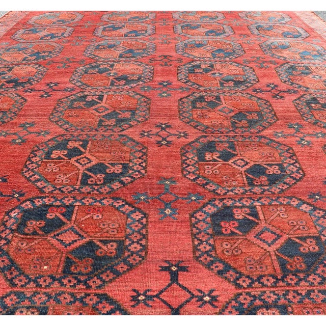 Persian Early 20th Century Hand-Knotted Turkomen Ersari Rug in Wool With Gul Design in Red, Orange and Blue For Sale - Image 3 of 13