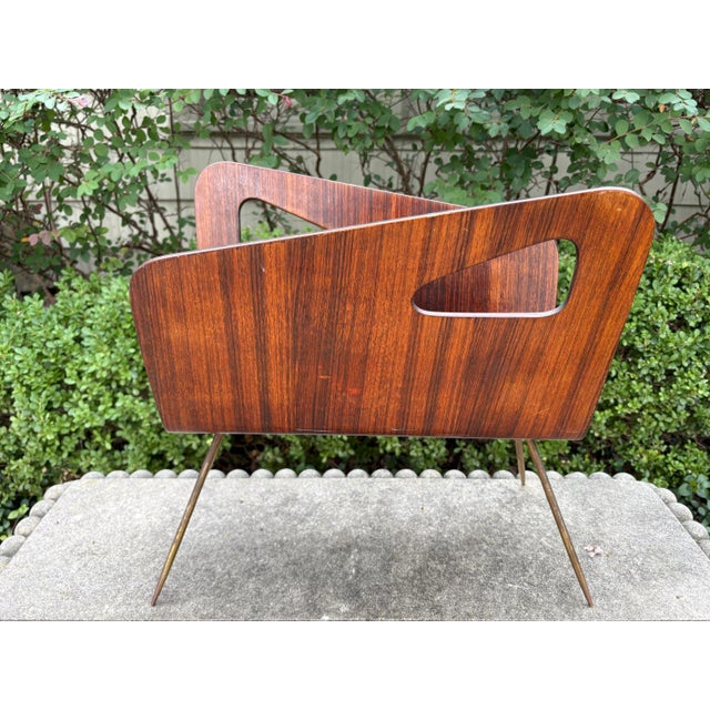 Italian Gio Ponti inspired brass and walnut magazine rack. This unusual Italian midcentury/modernist Gio Ponti inspired...