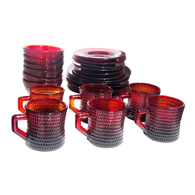 This is a stunning and somewhat rare set of vintage mid 20th Century UV Reactive ruby red hobnail-textured cups, saucers,...