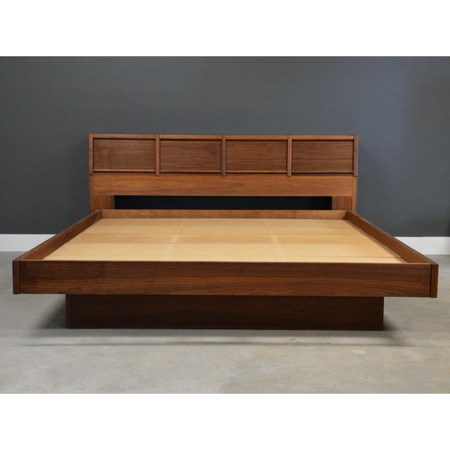 A mid century modern walnut king size floating platform bed by Barzilay. Made in USA. Circa 1960’s. Footboard is 15” high....