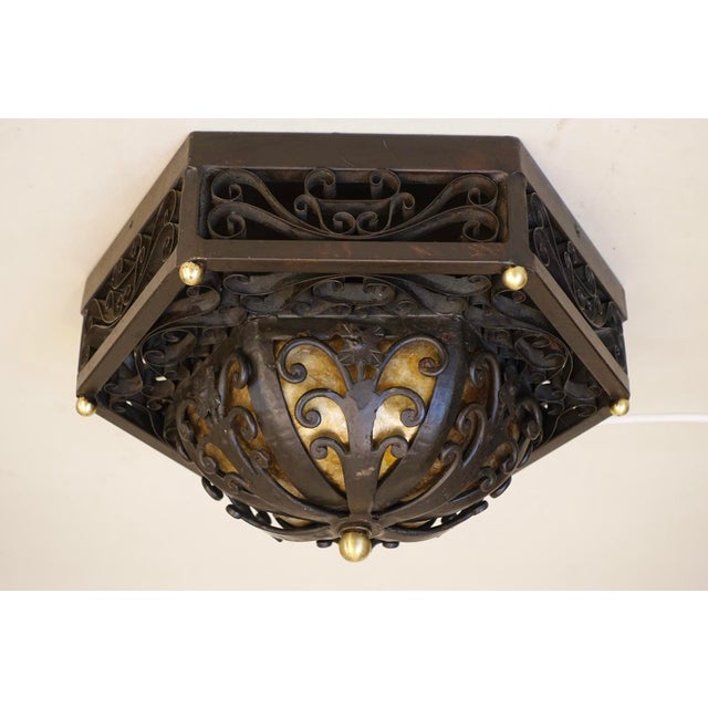 A dramatic and impressive Modern Spanish Revival octagon shaped form highly detailed wrought iron/steel ceiling lamp...