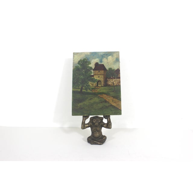 Vintage oil painting of a landscape with a castle gate. This is small and unframed. The painting is old and in good...