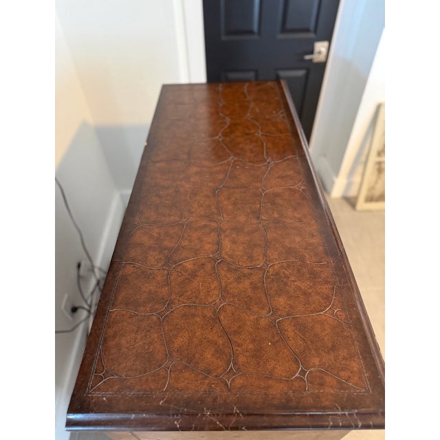 This was purchased 22 years ago through a designer at the Design District in Dallas. It is a beautiful piece. Have...