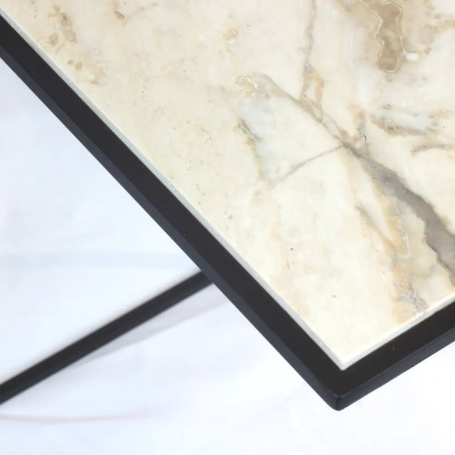 Elevate your interior with FramE, a side table that masterfully combines art and utility. Designed to showcase the...